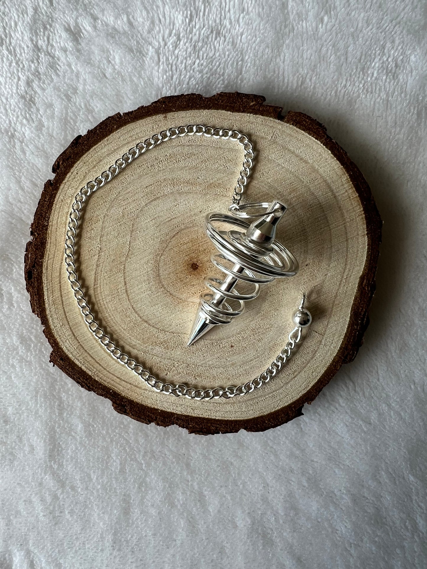 Pendule spirale en acier